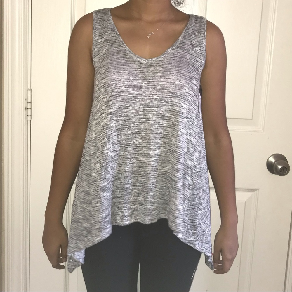 Grey sleeveless top.